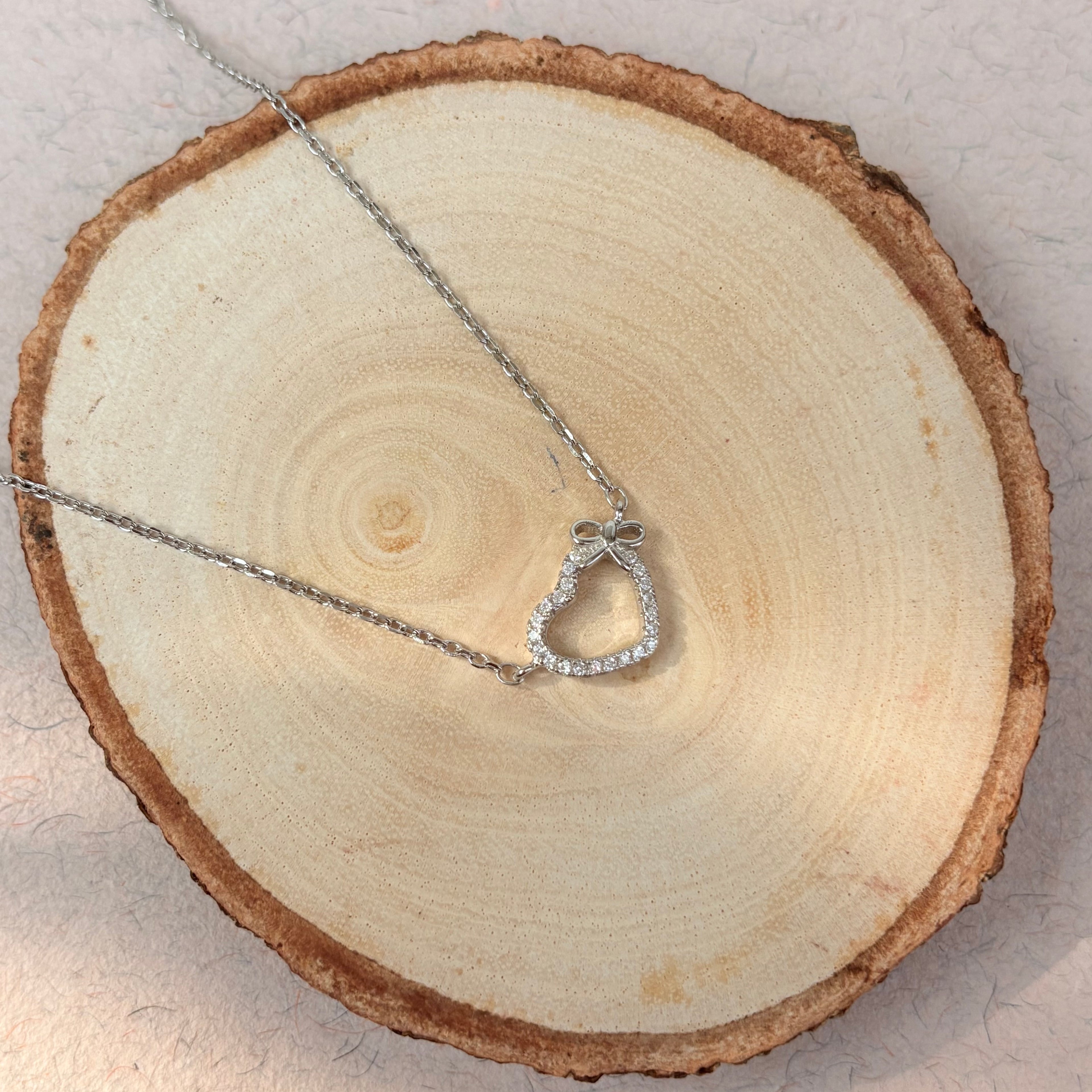 Sterling Silver Bow-Tied Open Heart Pendant Necklace